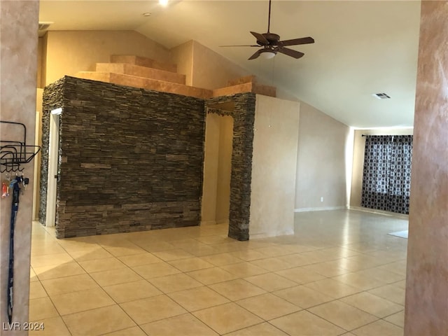 unfurnished living room featuring ceiling fan, light tile patterned floors, and high vaulted ceiling