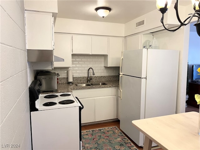 kitchen featuring white cabinets, white appliances, hardwood / wood-style floors, and sink