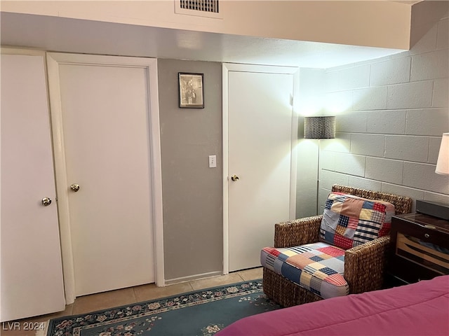 bedroom featuring a closet and tile patterned flooring