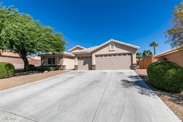 single story home featuring a garage