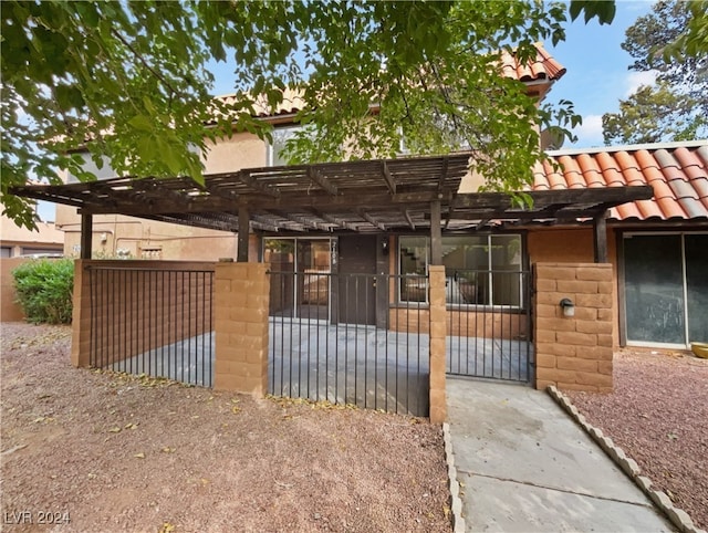 view of front of home with a pergola