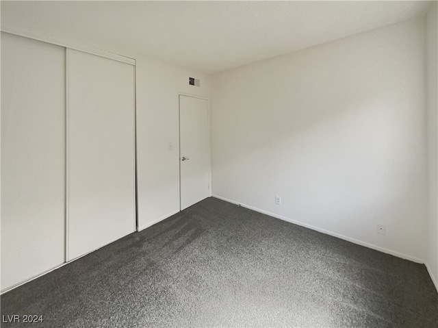 unfurnished bedroom with a closet