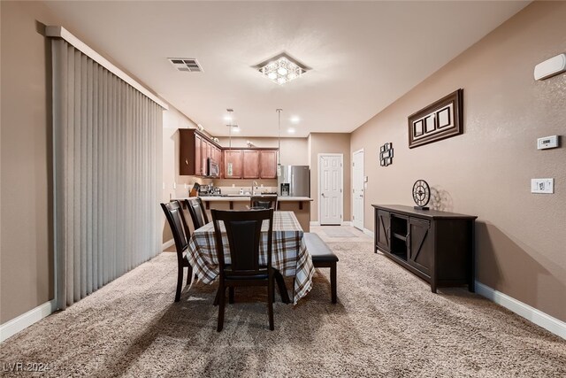 view of carpeted dining room