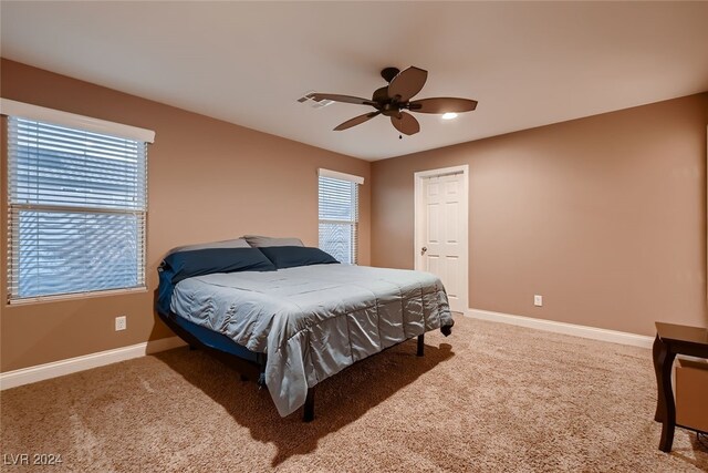 carpeted bedroom featuring ceiling fan