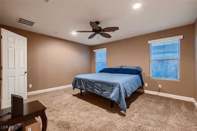 carpeted bedroom with ceiling fan