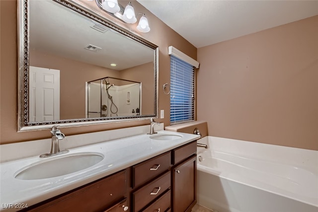 bathroom with plus walk in shower and vanity