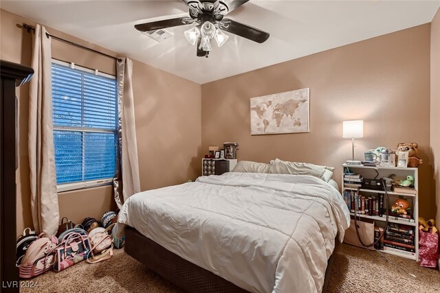 carpeted bedroom with ceiling fan