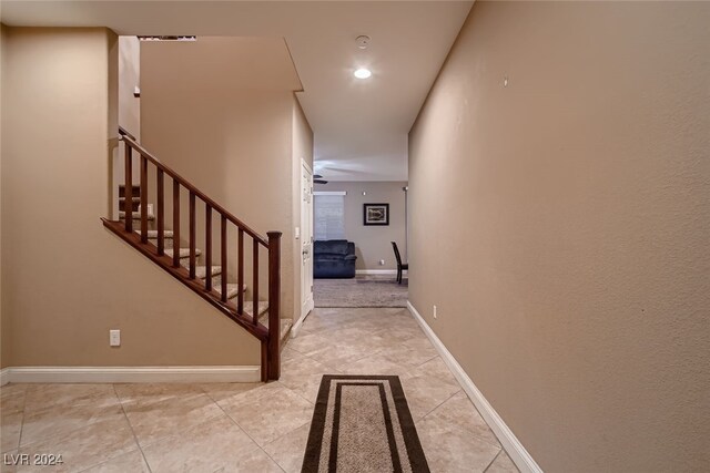 hall with light tile patterned flooring