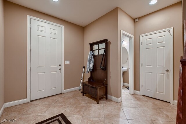 foyer featuring light tile patterned floors