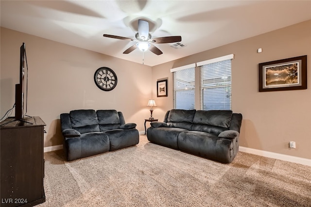 carpeted living room featuring ceiling fan