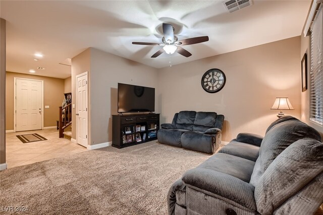 living room with light carpet and ceiling fan