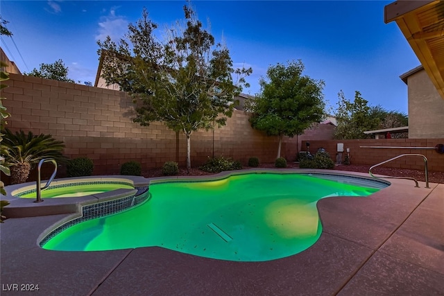 view of pool featuring an in ground hot tub and a patio area