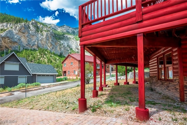 view of home's community with a mountain view and a garage