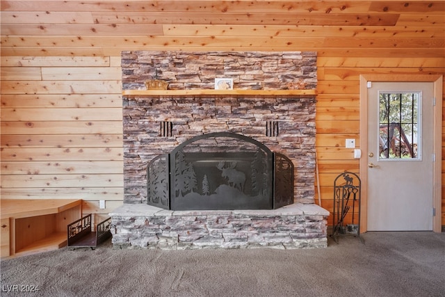 details with a fireplace, carpet, and wooden walls