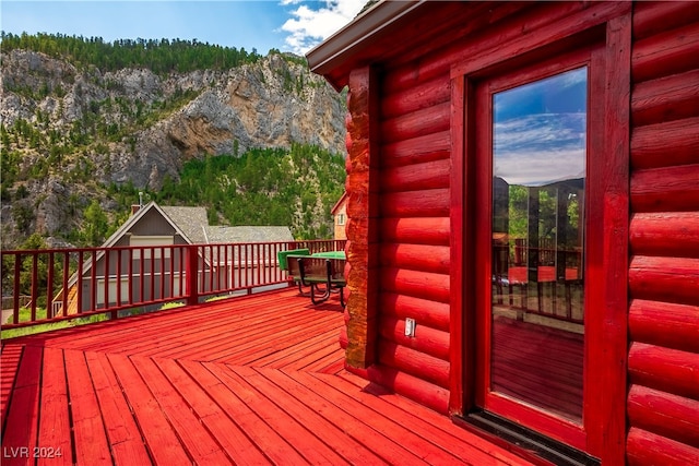 wooden terrace with a mountain view