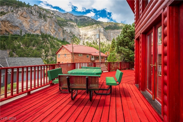 wooden deck featuring a mountain view