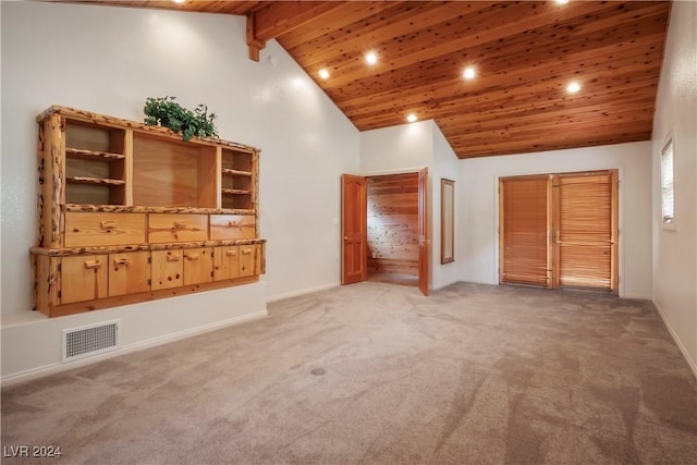 unfurnished living room featuring beamed ceiling, light colored carpet, wooden ceiling, visible vents, and recessed lighting