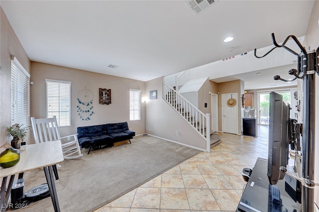 interior space featuring light colored carpet