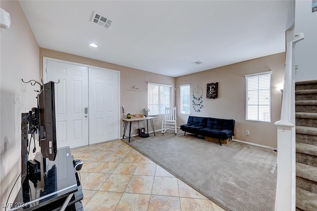 interior space featuring light colored carpet