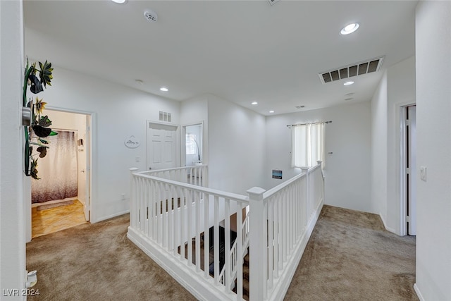 corridor with carpet flooring