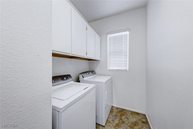 laundry room featuring cabinets and independent washer and dryer