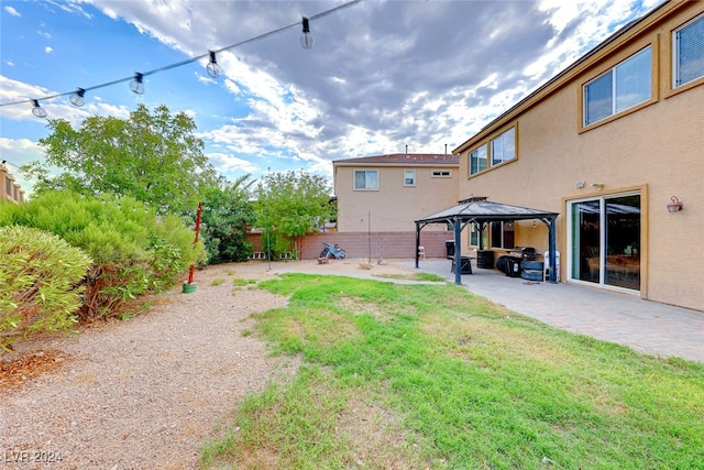 view of yard featuring a patio and a gazebo