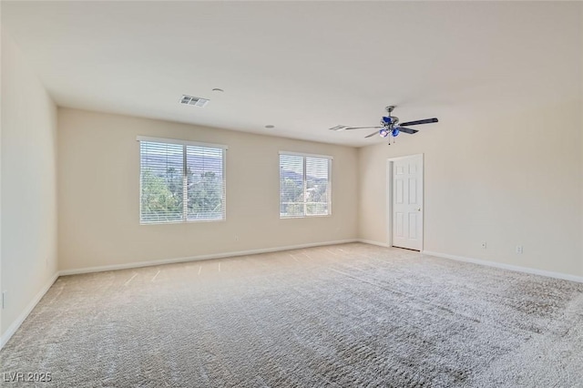 carpeted empty room featuring ceiling fan