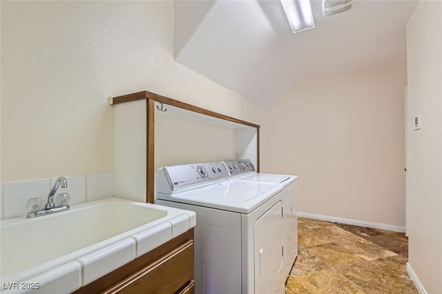 laundry area featuring sink and washing machine and dryer