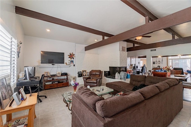 tiled living room with beam ceiling, a fireplace, and high vaulted ceiling