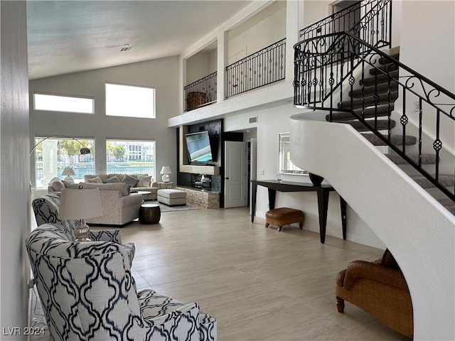 living room featuring high vaulted ceiling