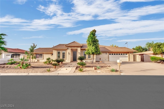 mediterranean / spanish-style house featuring a garage