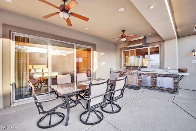 view of patio with exterior kitchen and ceiling fan