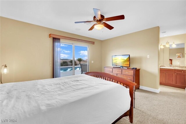 bedroom with light carpet, ceiling fan, connected bathroom, and access to outside