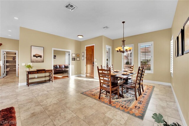 dining room with a chandelier