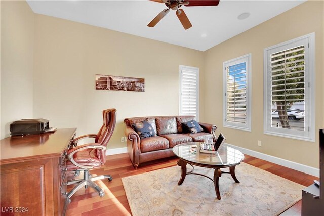 office area featuring light hardwood / wood-style flooring and ceiling fan