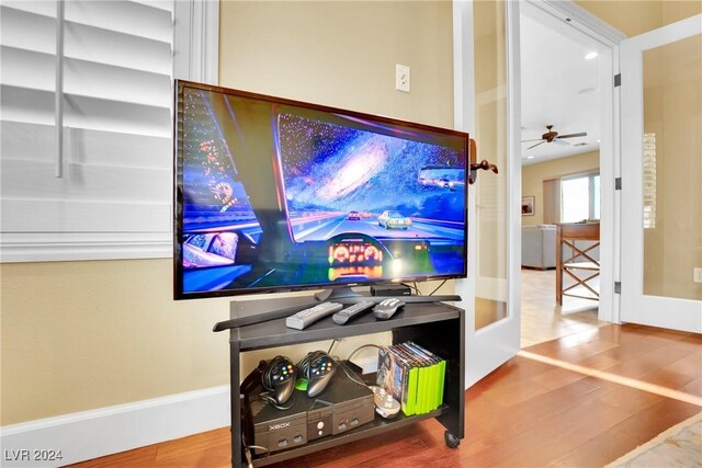 interior details with ceiling fan and hardwood / wood-style floors