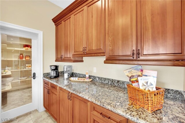 kitchen featuring light stone counters and light tile patterned floors