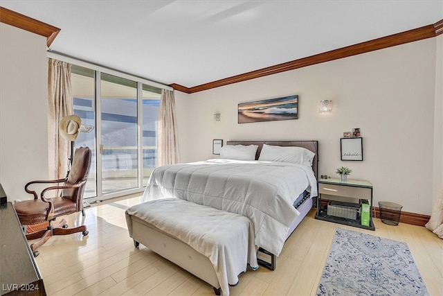 bedroom with ornamental molding, access to exterior, and light hardwood / wood-style flooring