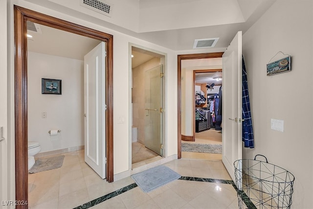 hall with light tile patterned flooring