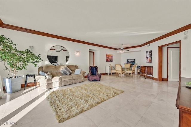 living room featuring ceiling fan and ornamental molding