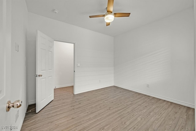 spare room with ceiling fan and light hardwood / wood-style floors