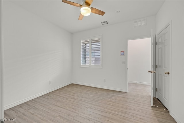 unfurnished room with ceiling fan and light hardwood / wood-style flooring