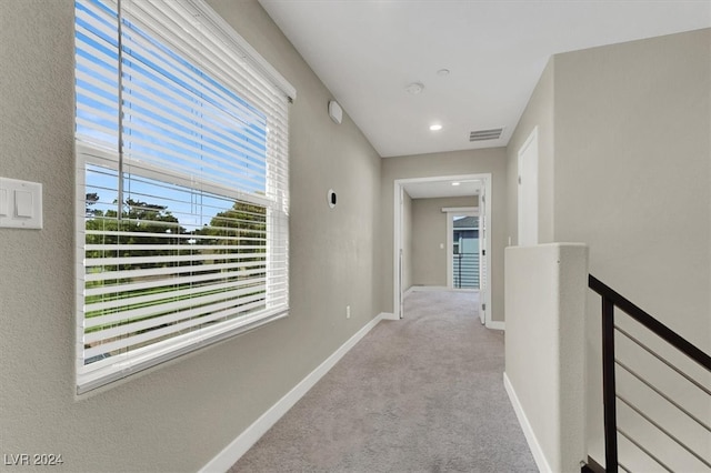 hallway with light carpet