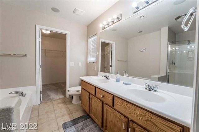 full bathroom with tile patterned floors, separate shower and tub, toilet, and vanity