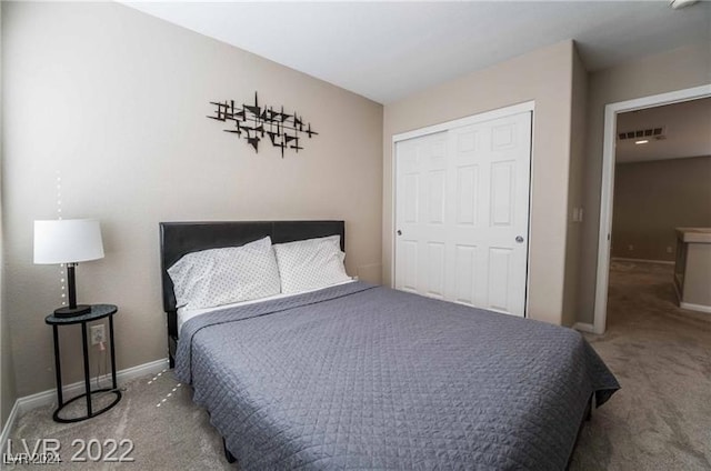 bedroom featuring a closet and carpet flooring