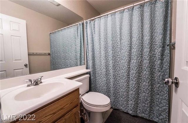 bathroom with a shower with curtain, vanity, toilet, and hardwood / wood-style flooring