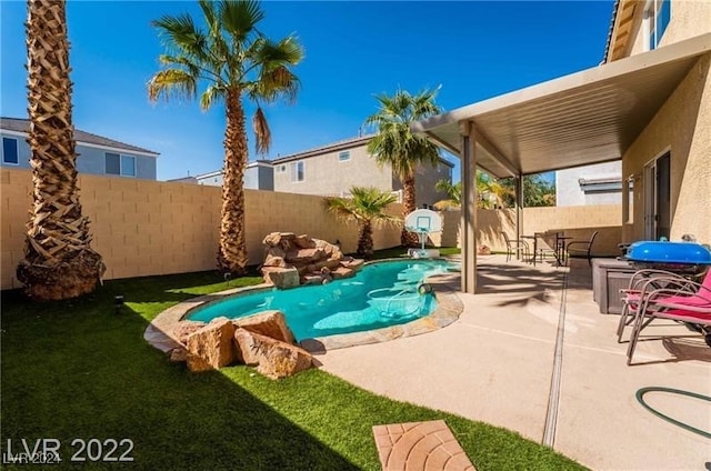 view of swimming pool with a patio