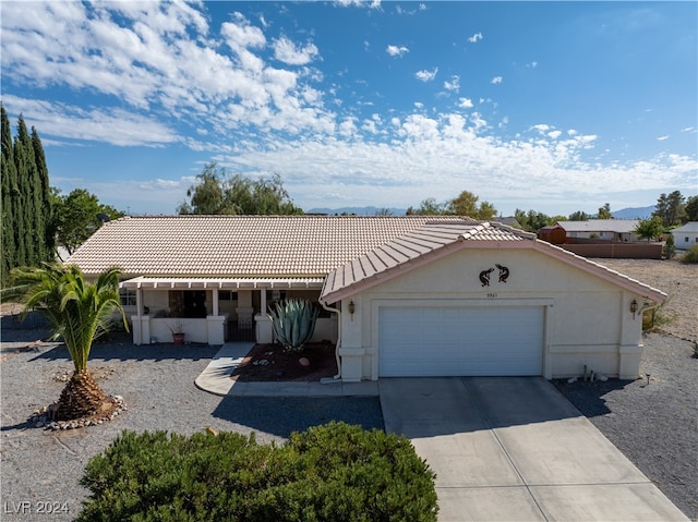 ranch-style home featuring a garage