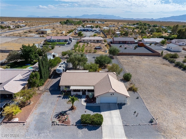 birds eye view of property featuring a mountain view