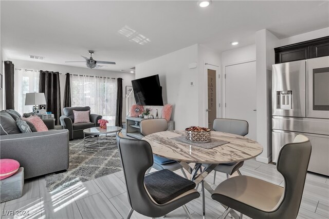 dining room with ceiling fan